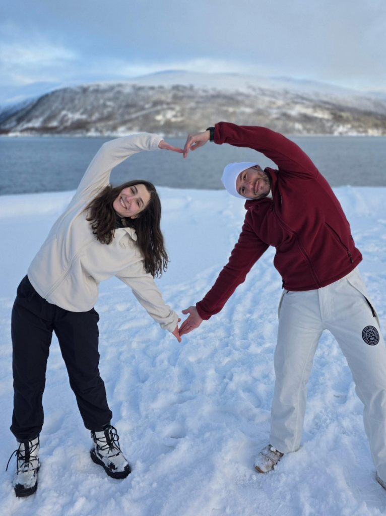 Active Travel Guides & Itineraries Ru and Tiago making a heart shape in the snow