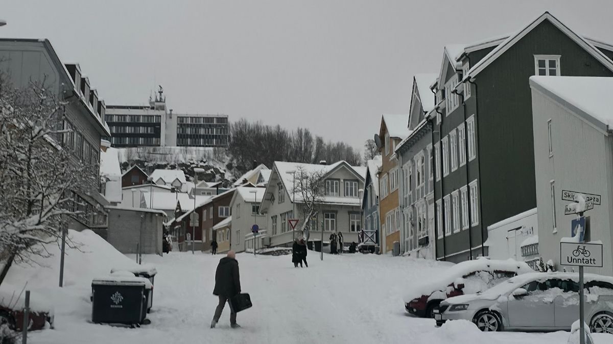 A picture showing some snowy and icy hills from the city of Tromso. 