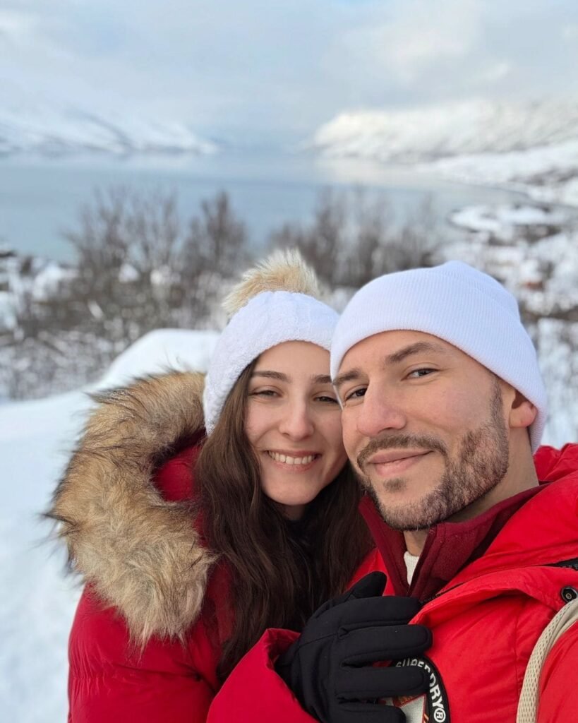 A selfie in front of Ersfjord with  rugged mountains and fjords.