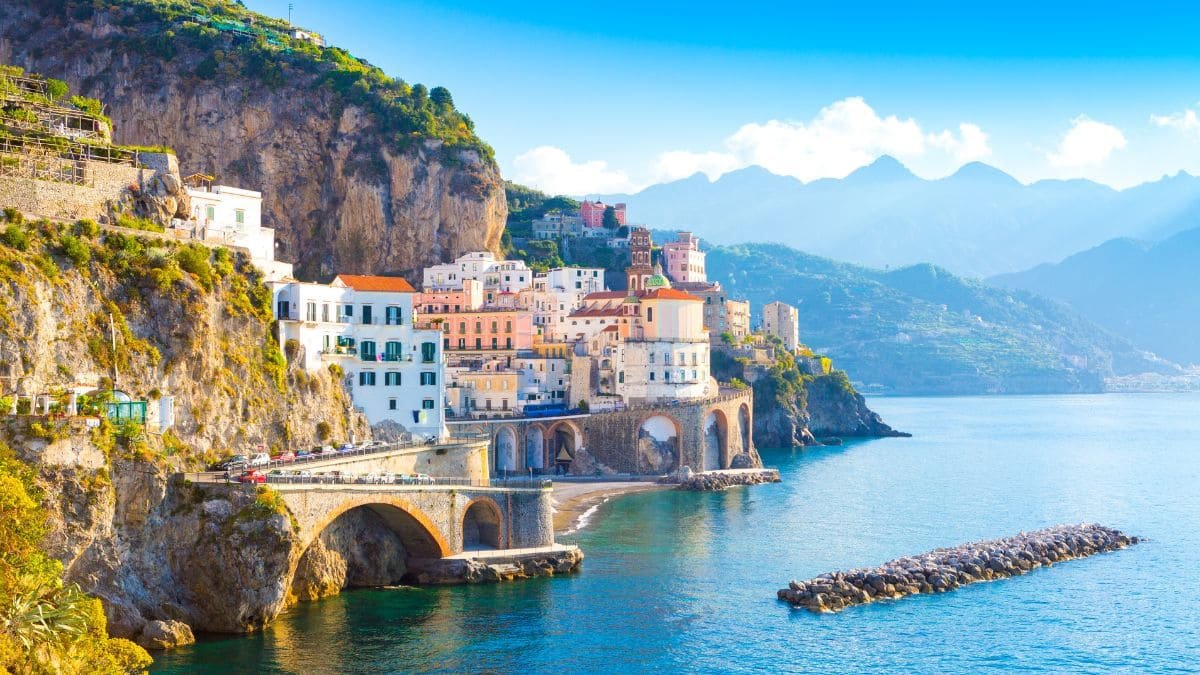 Scenic coastal road view of Amalfi, Italy – breathtaking drive along the Amalfi Coast with sea cliffs and turquoise waters.