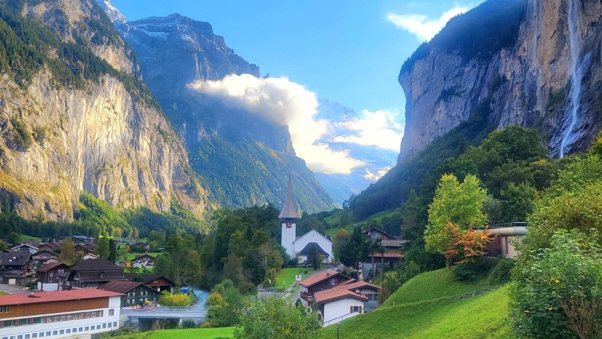Scenic hiking trail in Lauterbrunnen, Switzerland, with breathtaking views of waterfalls, Swiss Alps, and lush green meadows. Perfect destination for outdoor adventure and nature lovers.