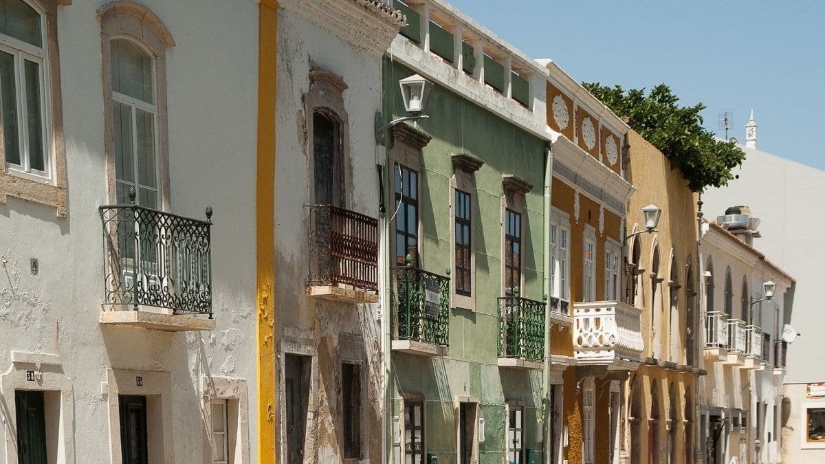 Tavira Old Town – A charming street in Tavira with traditional Portuguese houses and tiled facades.