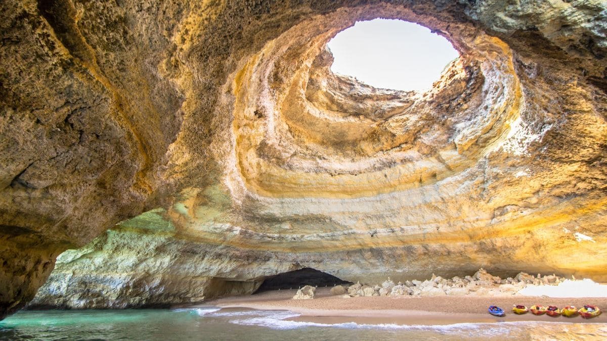 Benagil Cave – Inside the famous Benagil Cave with its natural skylight and golden sandy beach.