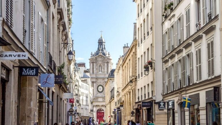 Historic buildings with classic Parisian architecture in the Le Marais district