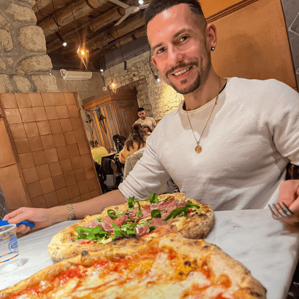 The happy face of Tiago right before eating our first pizza in Naples