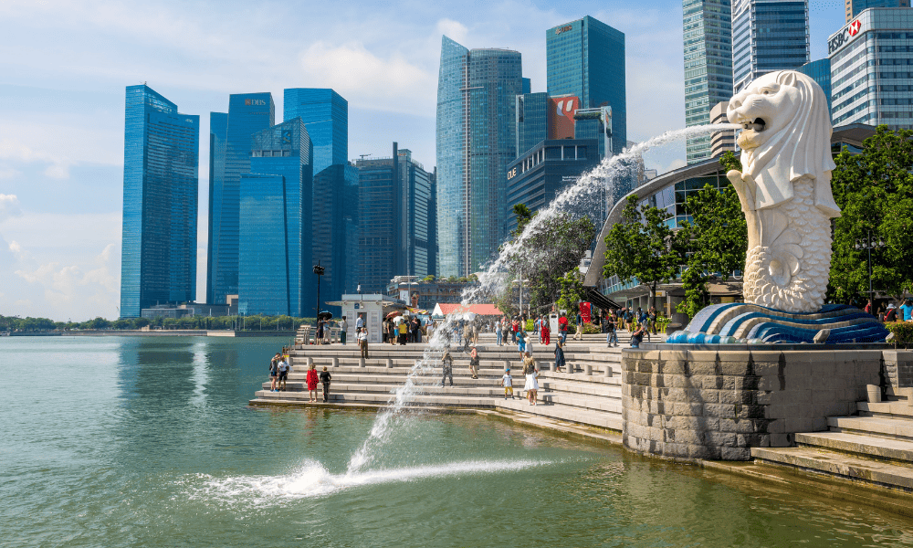 The Merlion statue with the tall buildings in the background in Singapore