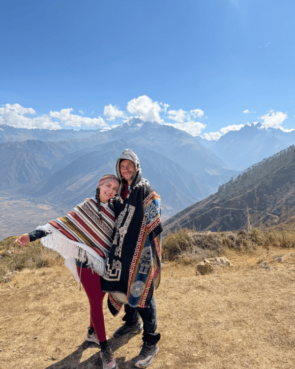 Ru & Tiago in traditional Andean ponchos on the alpaca walk, Sacred Valley