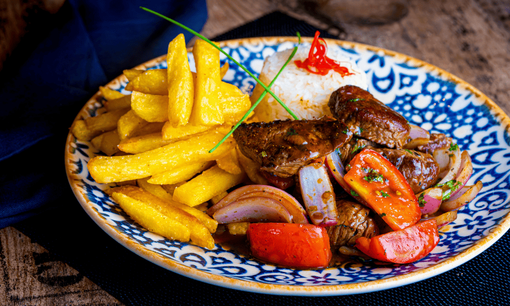Food in Peru: A Region-by-Region Guide to Eating Your Way Across the Country (2026) Food in Peru Local Food Guides Lomo Saltado - traditional dish in Peru